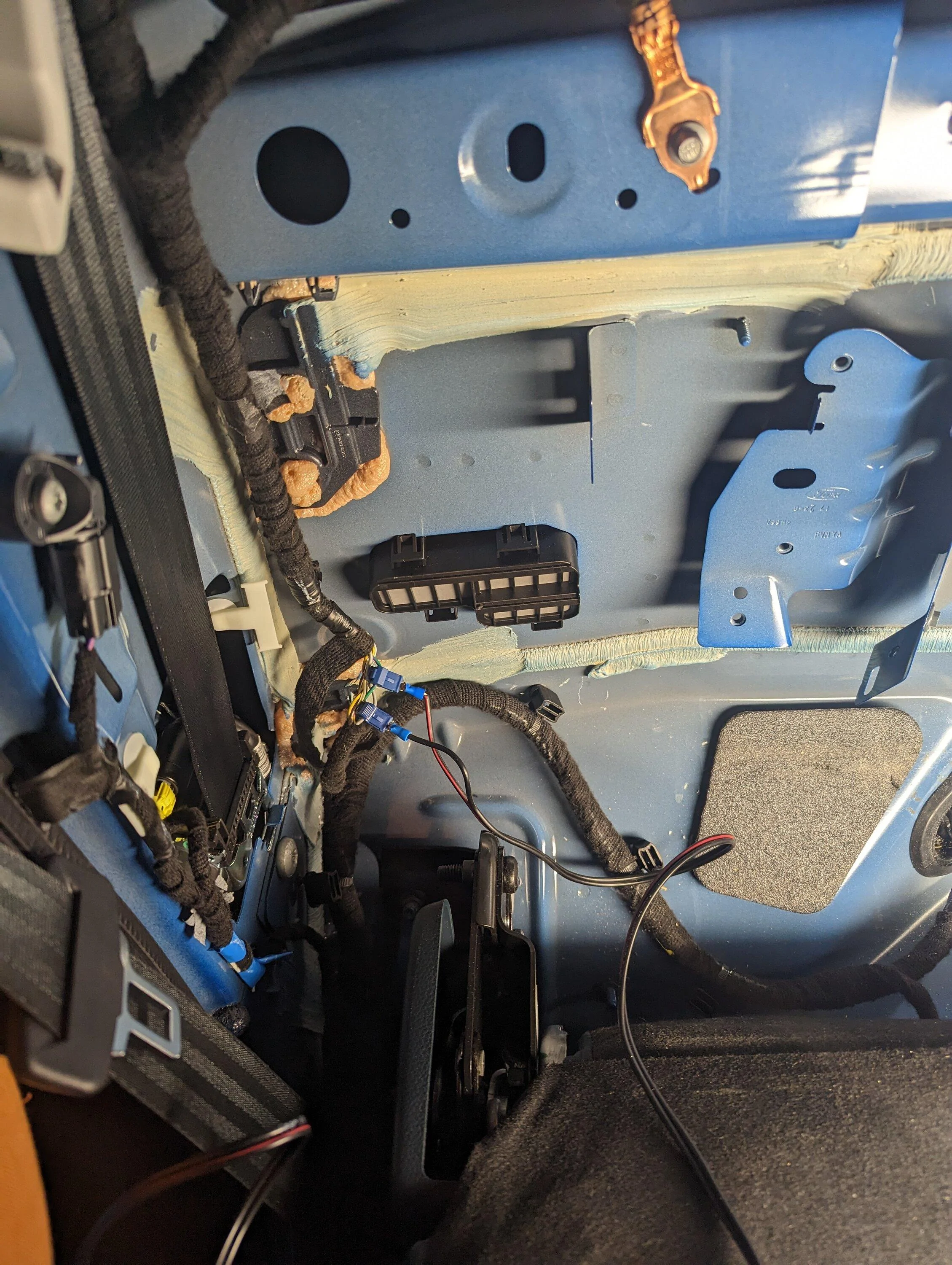 Ford Maverick Rear speaker wires for sub install -- use this location to tap into the left and right speakers PXL_20230312_021954814