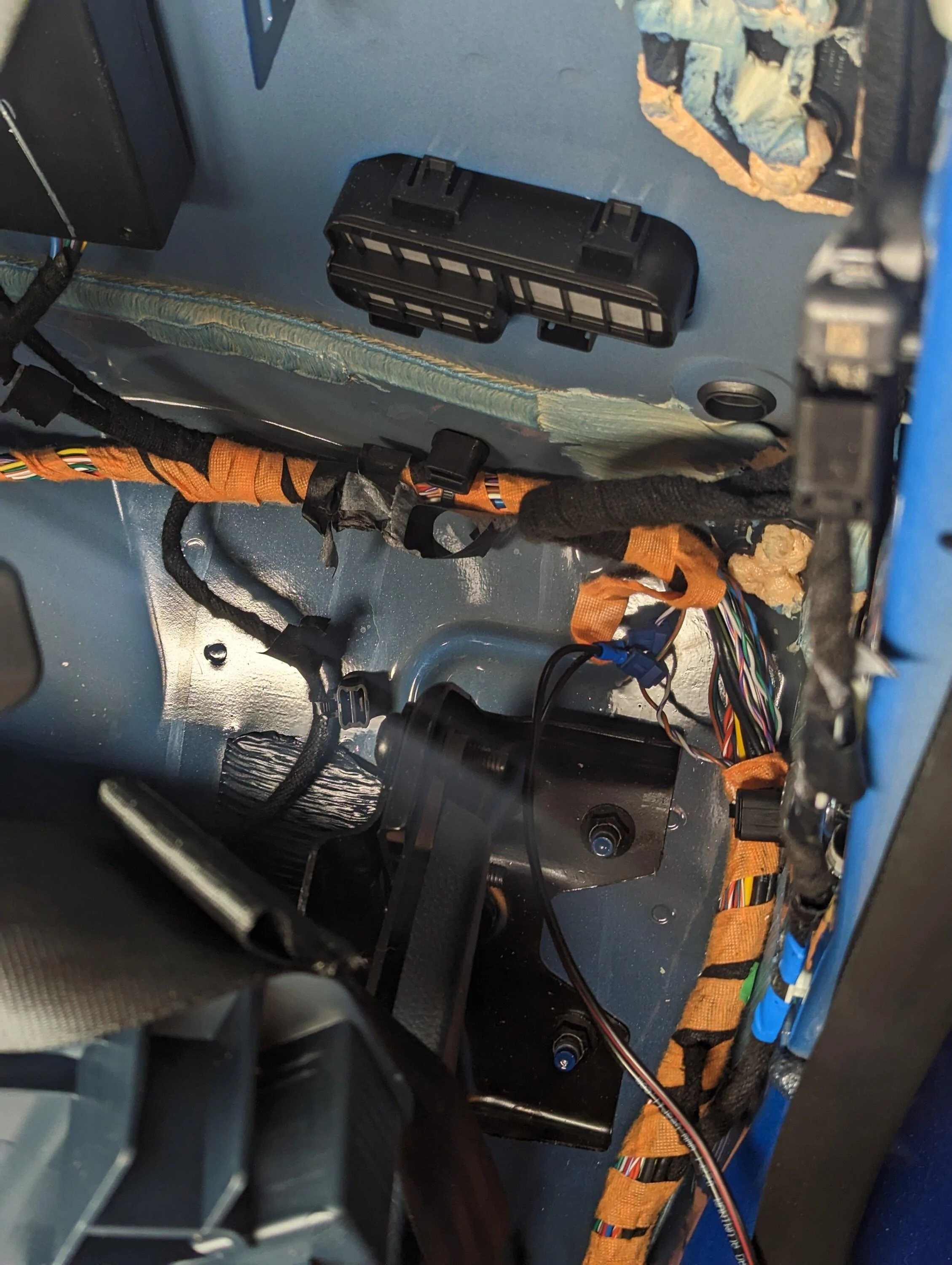 Ford Maverick Rear speaker wires for sub install -- use this location to tap into the left and right speakers PXL_20230312_013655110