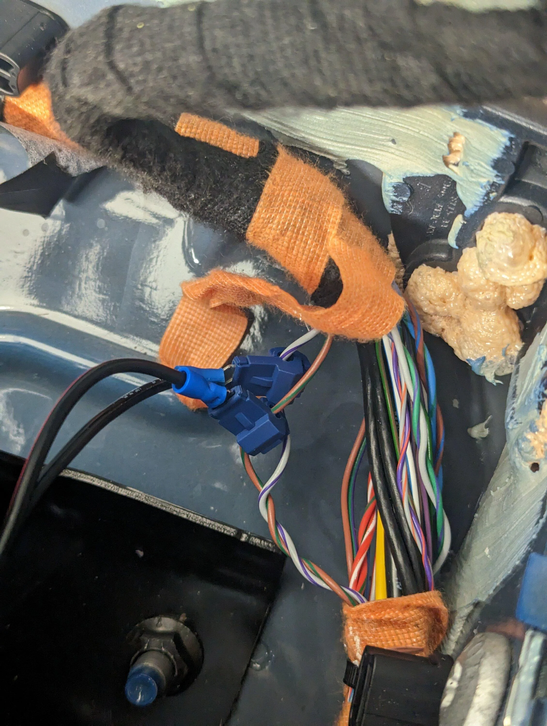 Ford Maverick Rear speaker wires for sub install -- use this location to tap into the left and right speakers PXL_20230312_013618456