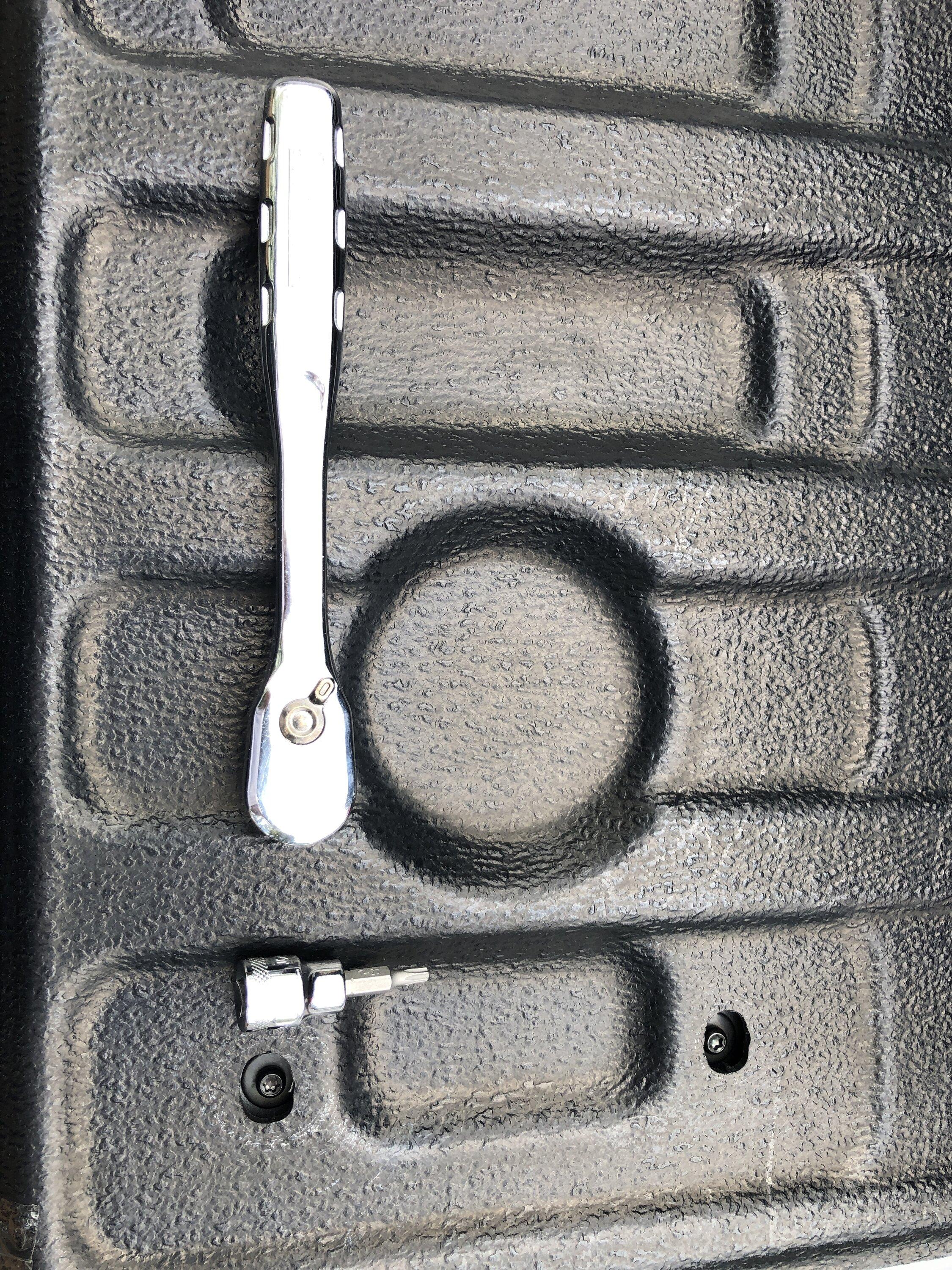 Ford Maverick Did Muslogy mud laps and tail gate liners add-on today Liner with tools before install.JPG