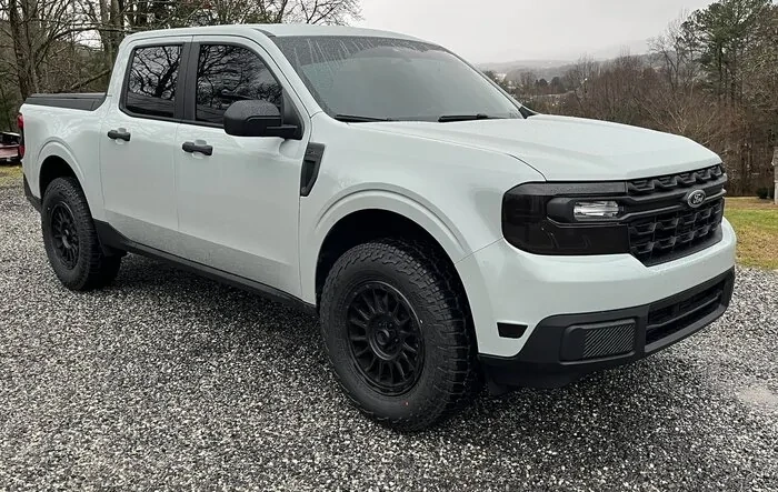 Cactus Gray Maverick XL build w/ smoked film headlights & tail lights, window tint, KMC aftermarket wheels, 1" leveling kit