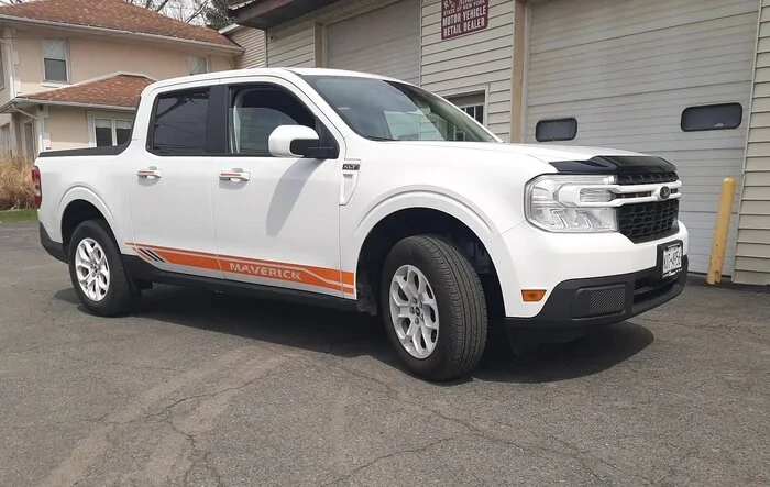 My Maverick XLT w/ painted white wheels, stripes, aeroshield, raised lettering on the tailgate