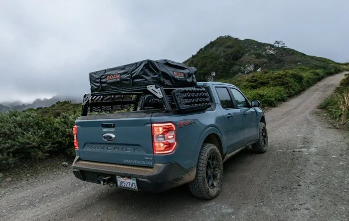 Camping above the clouds with the Maverick (on  2” lift, 245/65 Wildpeaks, ROAM tent, Xtrusion Overland XTR1 rack)!