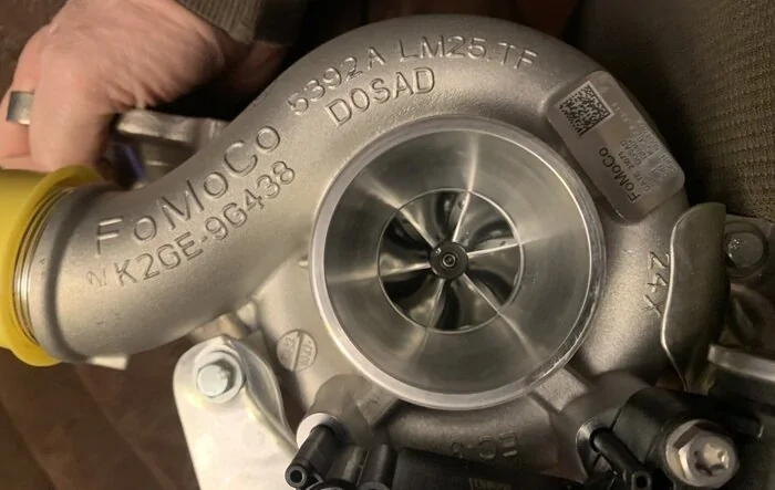 Upgraded 2.0 EcoBoost turbos coming from Buschur, pics of the tiny stock factory turbo