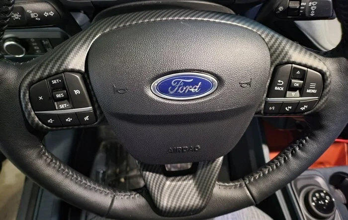Carbon steering wheel trim installed