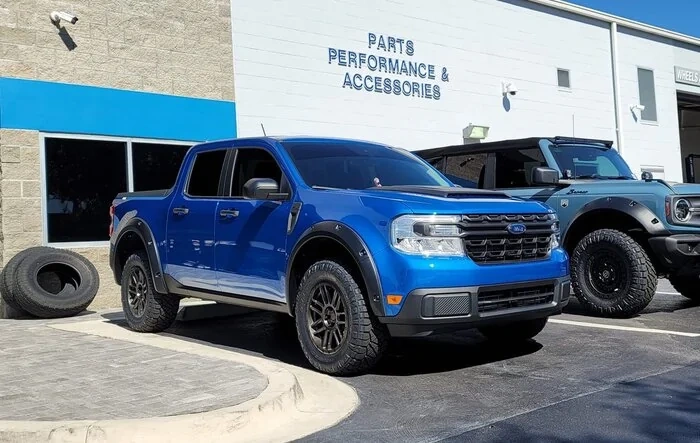 Velocity Blue Maverick XL Upgraded w/ Hood Scoop, Tailgate Spoiler, Fender Flares, Black Rhino Wheels, Lift Kit