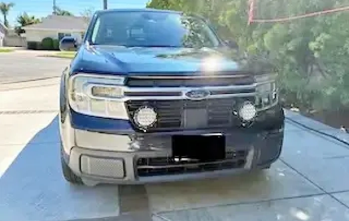 Retro-look driving lights installed on grille