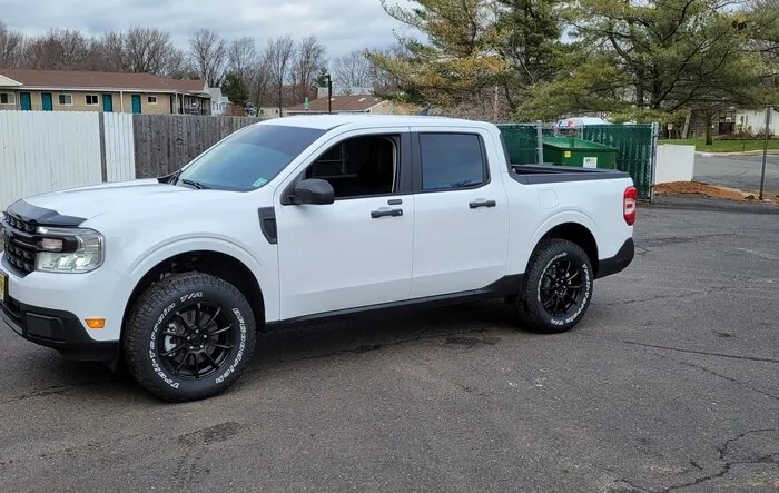 New add ons: 2" Rough Country lift. 245/70/17 BFG Trail Terrain tires. Hood aeroskin